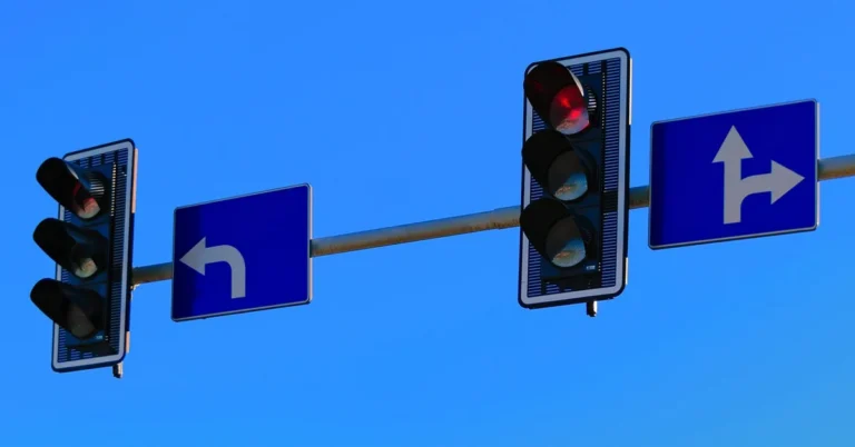 Traffic lights and turn-lane signs at a city intersection where T-bone crashes most often occur