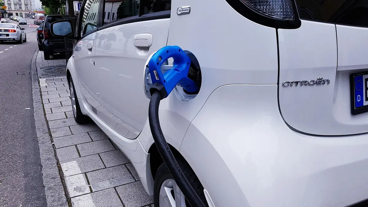 Electric car plugged into a home charging station