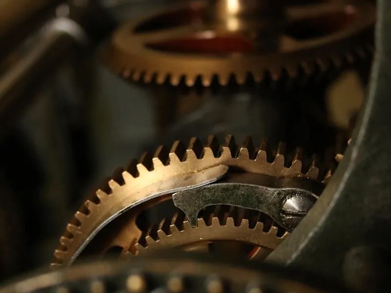 Close-up of brass gears inside a clock mechanism