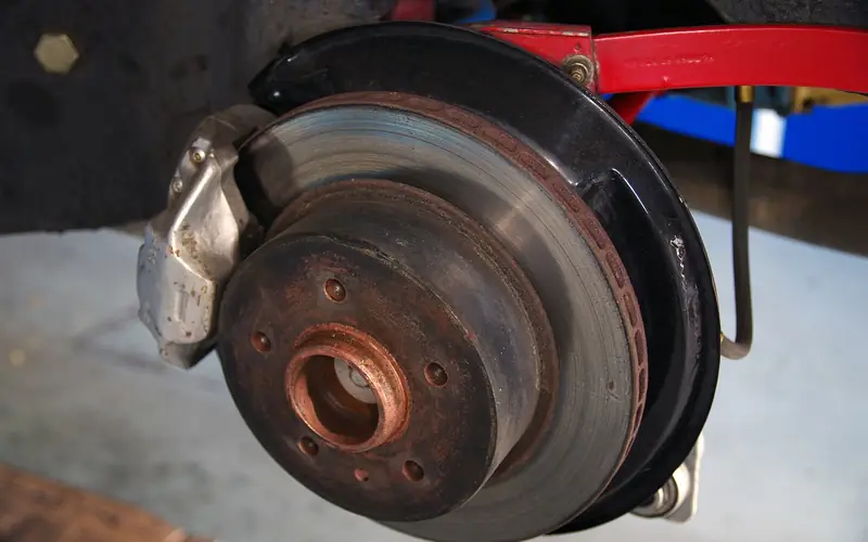 Rear brake rotor with surface rust on the hub and rotor edge