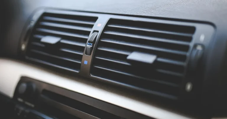 Car dashboard air vents close-up