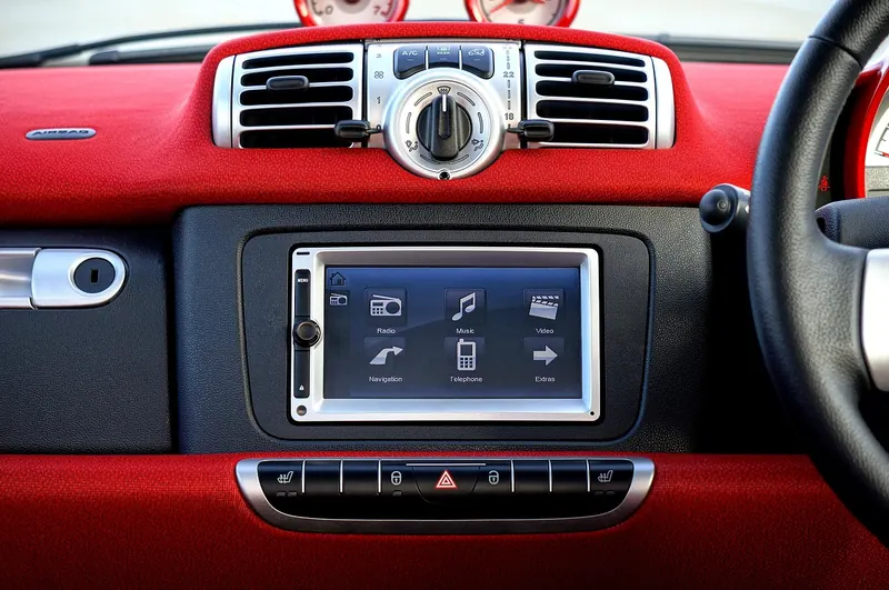 Car dashboard with a touchscreen head unit and climate controls Car dashboard with a touchscreen head unit and climate controls