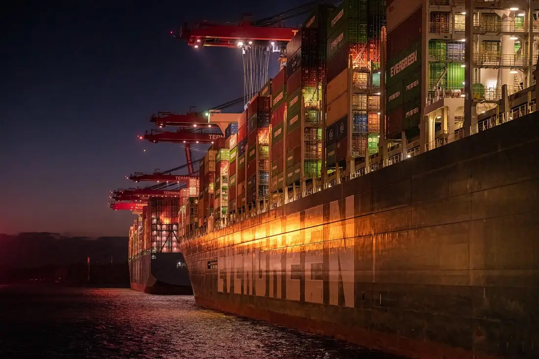 Cargo ship at a shipping port with containers
