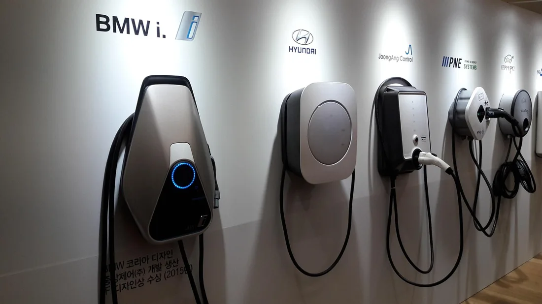 Electric vehicle plugged into a charging station