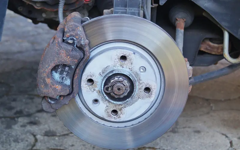 Front disc brake with caliper and brake pad visible