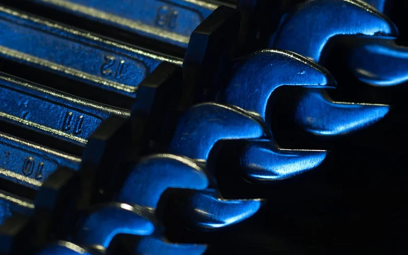 Row of open-end wrenches sorted by size, the basic hand tools for a DIY oil change