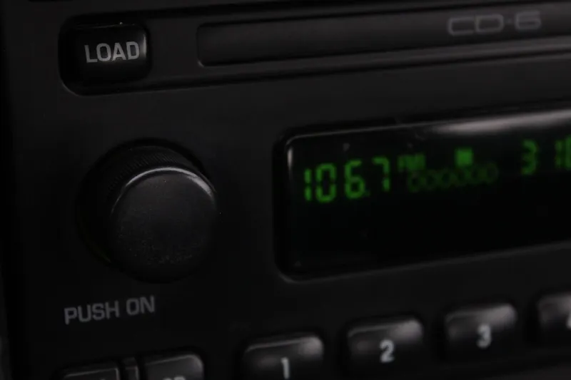 Older car radio display tuned to FM 106.7