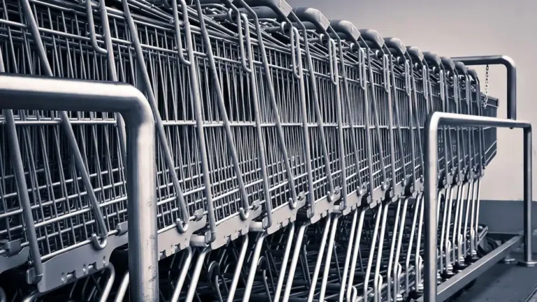 Row of nested shopping carts outside a warehouse-style store