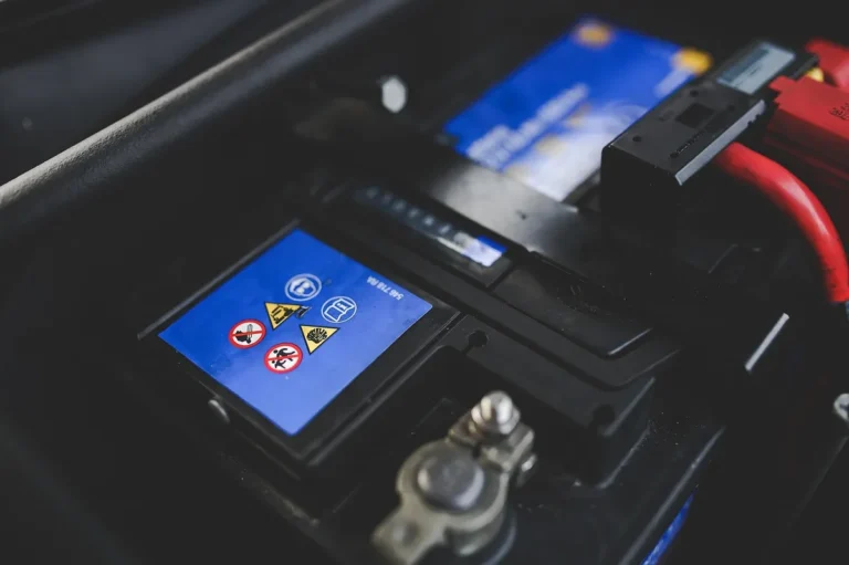 Car battery terminal with warning label, the connection point terminal connectors clamp onto