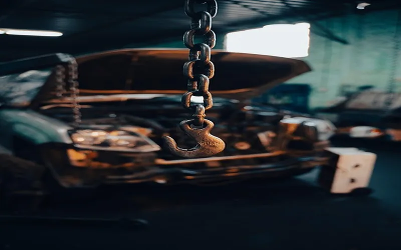 Mechanic diagnosing a car engine running lean condition