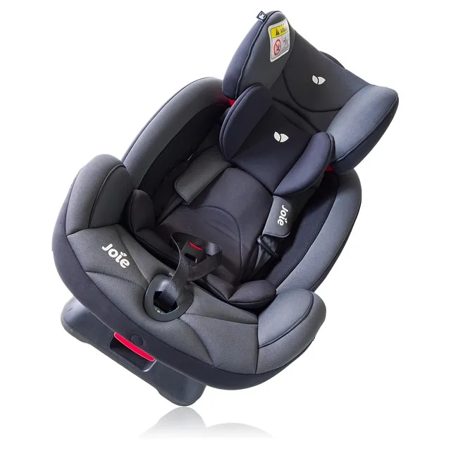 Checking the buckle and harness for wear before replacing an expired car seat