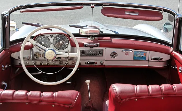 Car dashboard view showing the sun visor mounted above the windshield