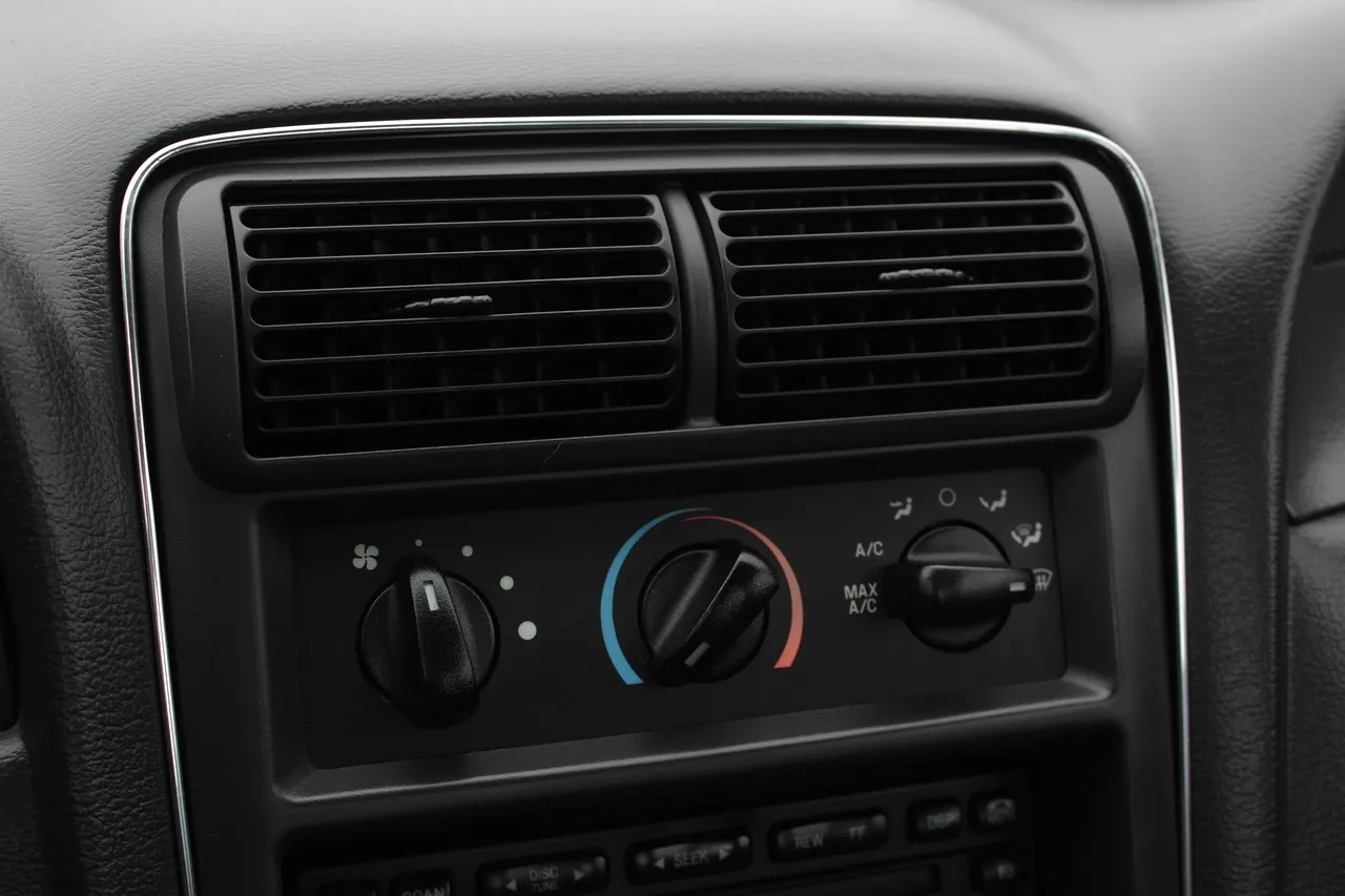 BMW dashboard climate control panel with physical buttons