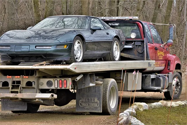 Flatbed tow truck hauling a donated car