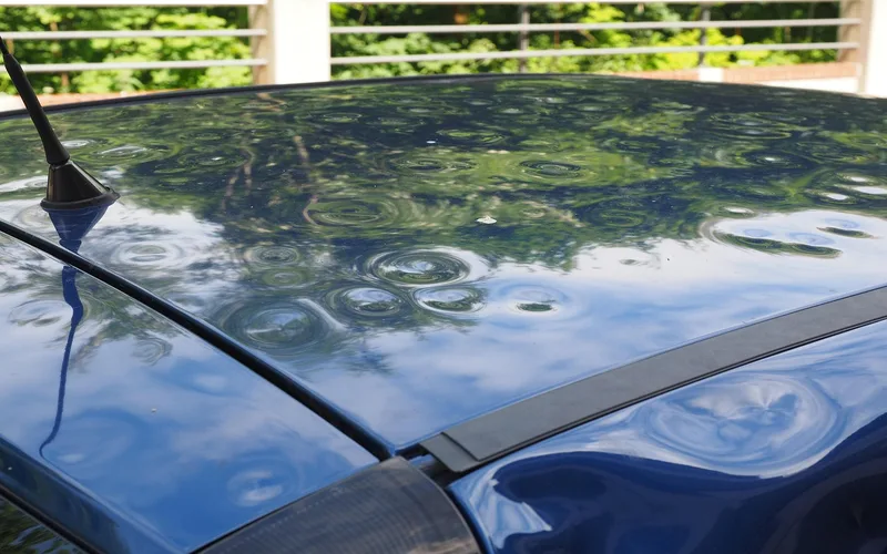Hail dents on car hood showing typical damage pattern