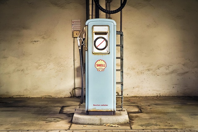 Gas pump at fuel station - choosing the right fuel additive like HEET for your car