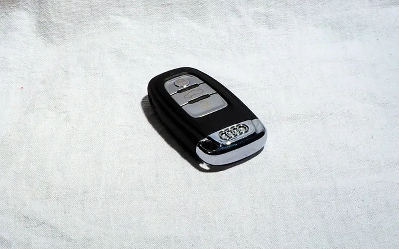 Car key fob held in hand — how to change key fob battery