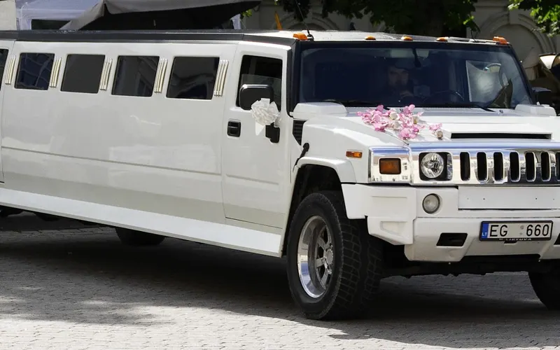 white stretch limousine, an example of an extended novelty car