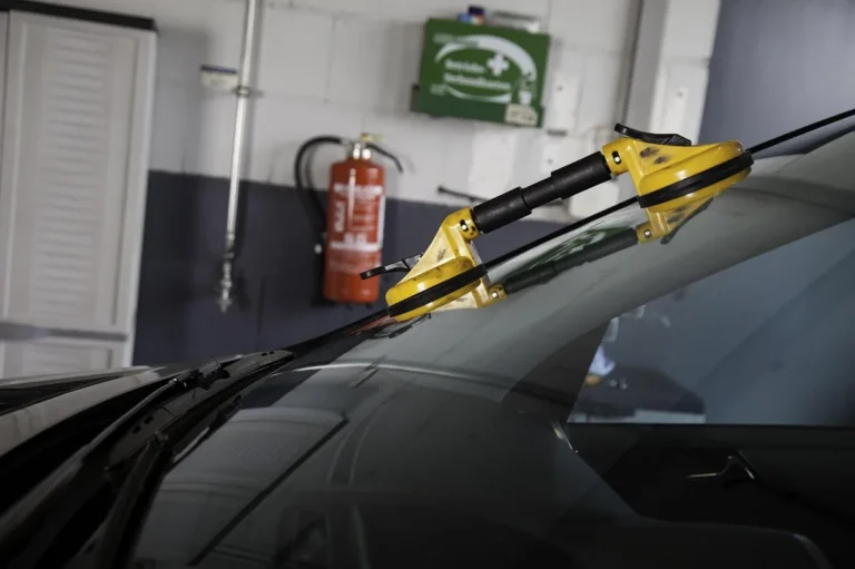 Broken car window glass, the kind of damage a temporary cover protects until repair