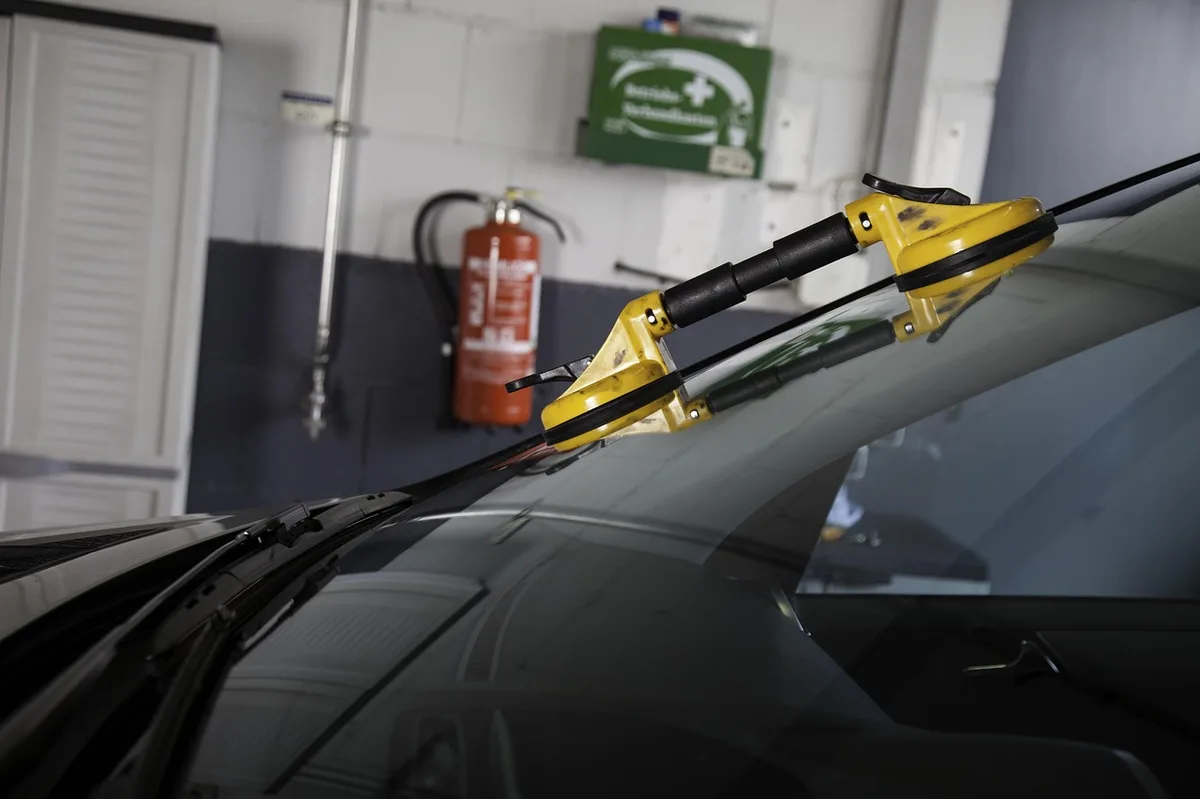 Broken car window glass, the kind of damage a temporary cover protects until repair