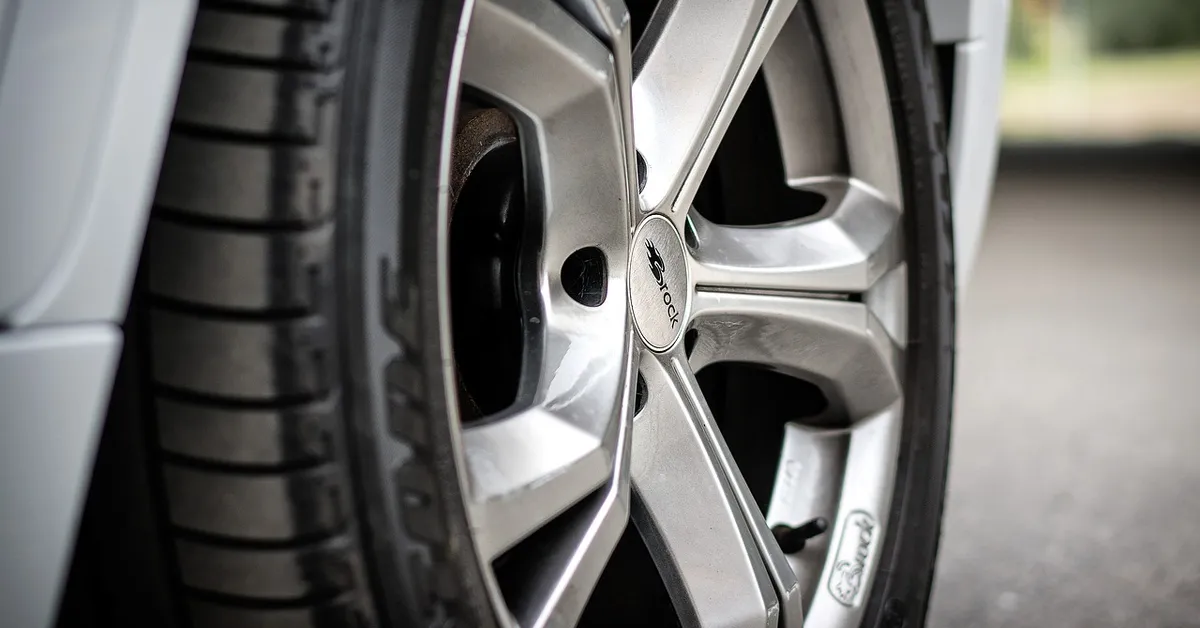 Close-up of an alloy wheel and locking lug nut on a car similar to a BMW wheel lock setup