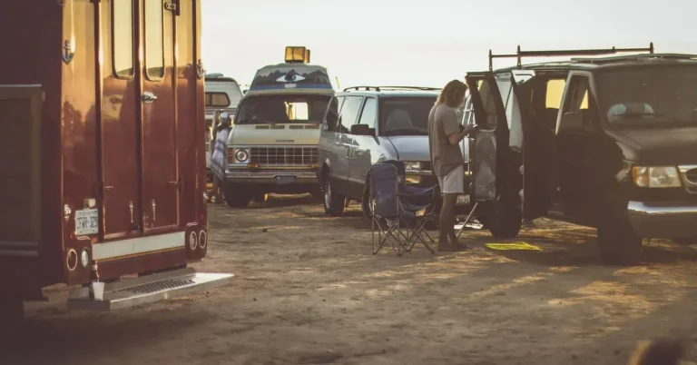 Camper vans parked together for an overnight car camping trip