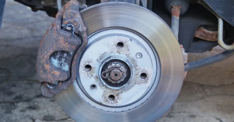 Close-up of a car brake caliper and disc rotor