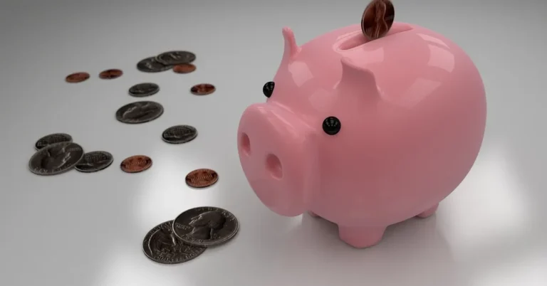 Piggy bank and coins representing a car buying budget