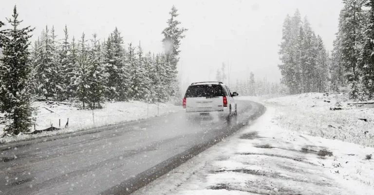 Car driving on a snowy winter road