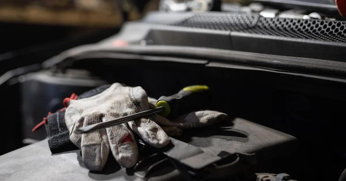 Checking coolant level in a car engine bay