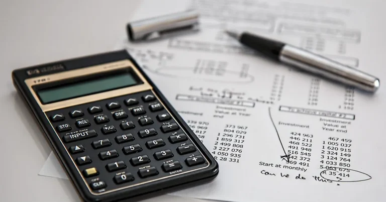 Calculator and financial documents used to check credit