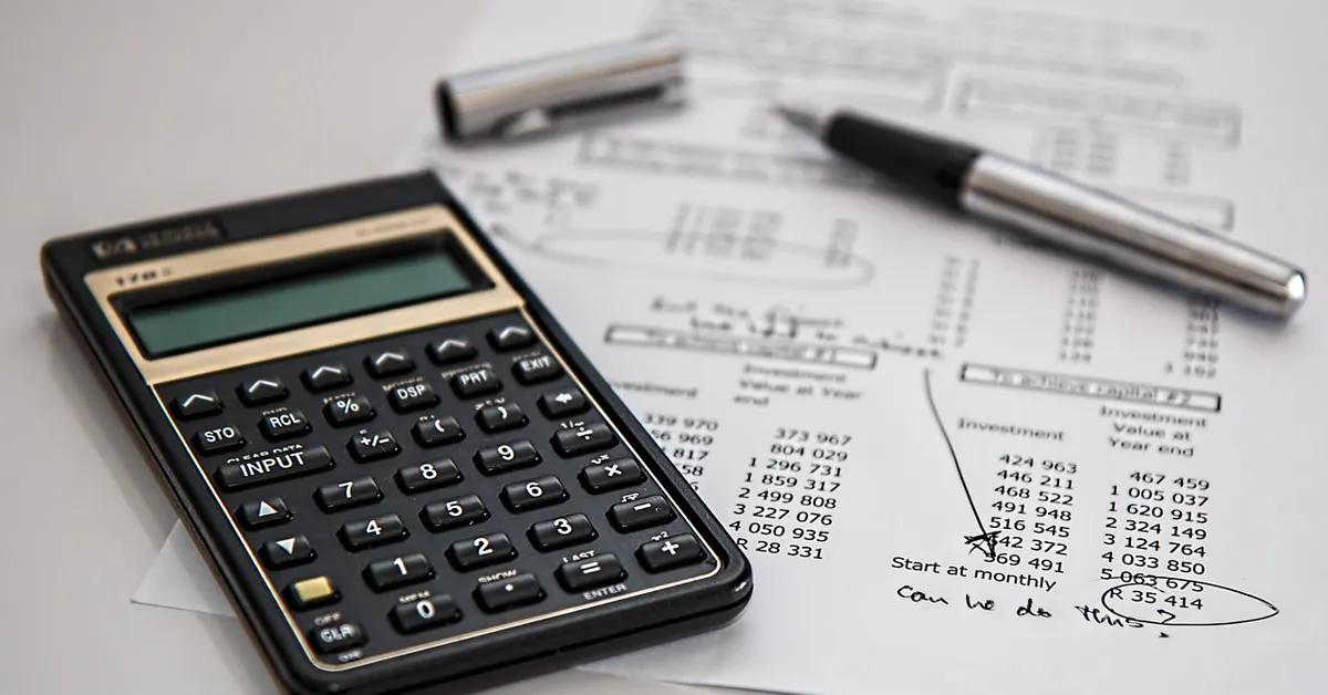 Calculator and financial documents used to check credit