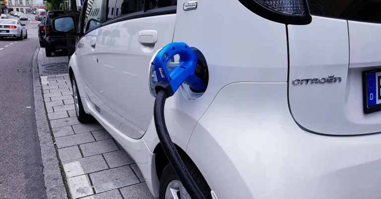 Electric car charging cable plugged into a vehicle