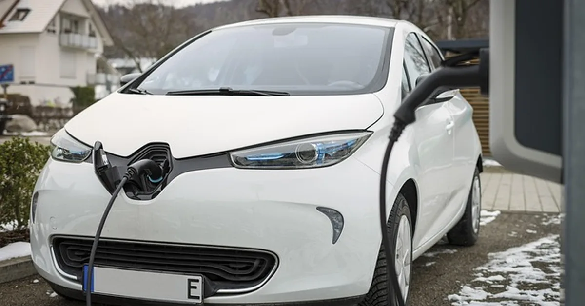 Electric hybrid car charging outdoors