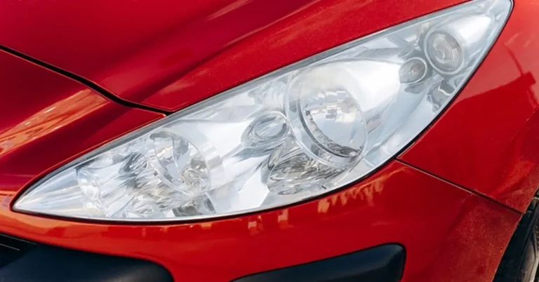 Closeup of a car headlight and fog light housing