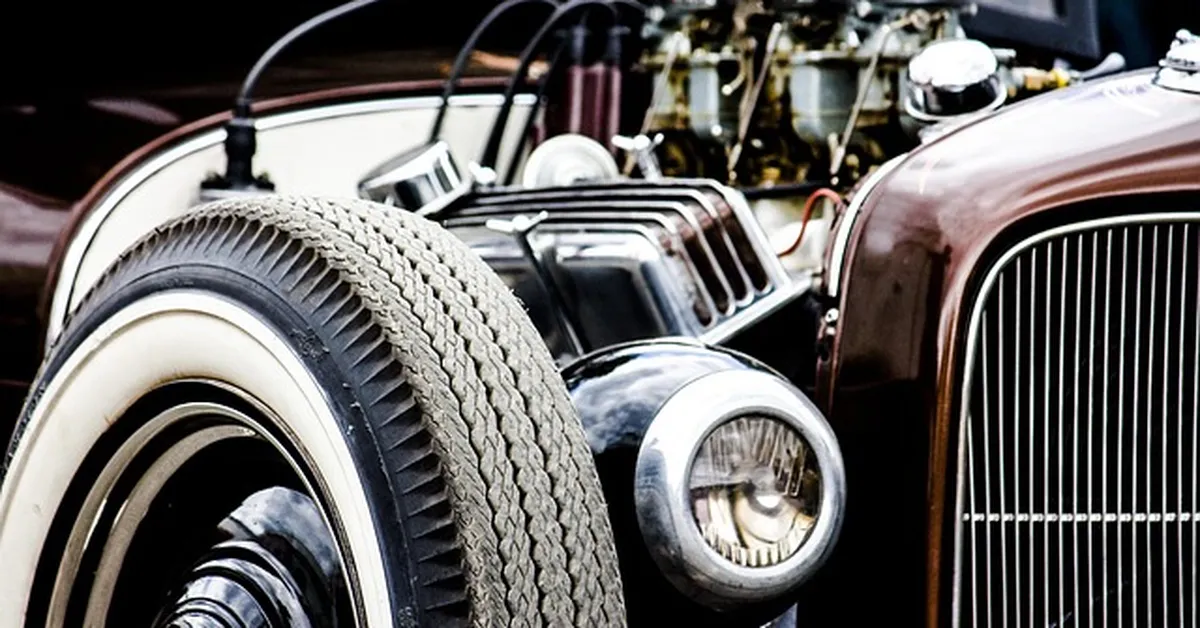 Classic V8 big-block engine with chrome valve covers and multiple carburetors
