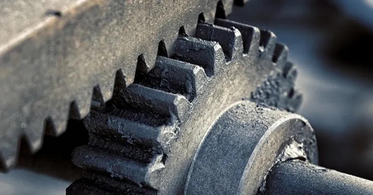 Close-up of interlocking steel gear teeth representing rear differential gear ratios