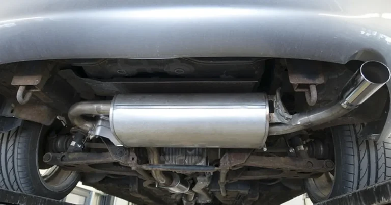 Underside view of a vehicle exhaust system and muffler where oxygen sensors are mounted