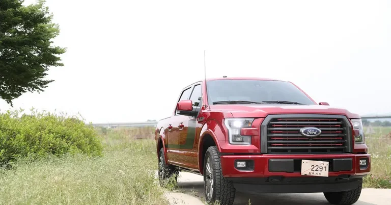 Red Ford F150 pickup truck with visible Ford grille badge