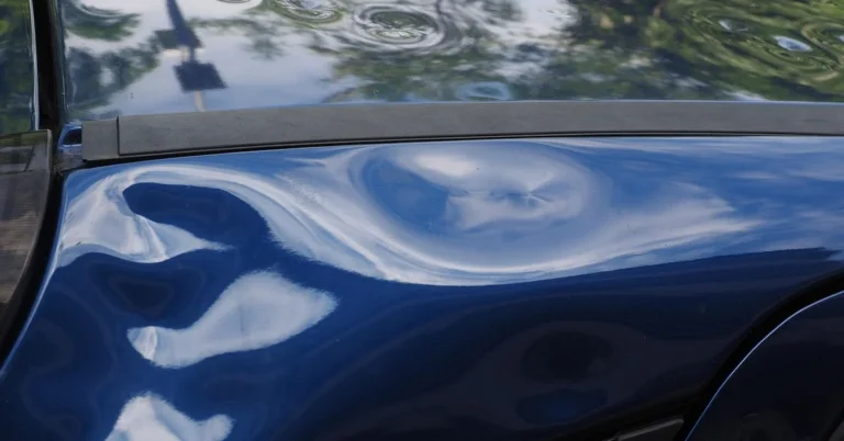 Car roof with hail damage dents before filing an insurance claim