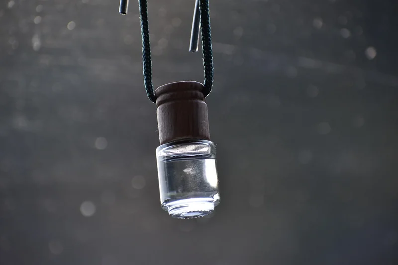 Hanging Essential Oil Car Diffuser Hanging essential oil car diffuser bottle catching sunlight