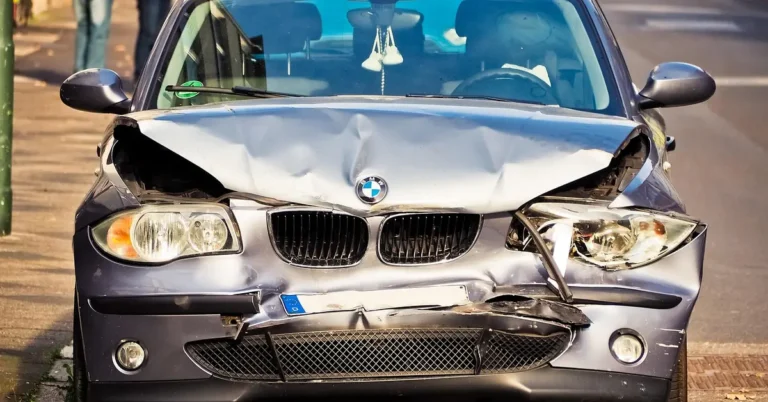 Wrecked car after a crash showing why car insurance is required