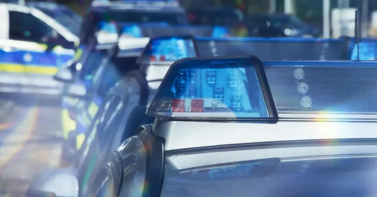 Police patrol cars with lights on during a traffic stop