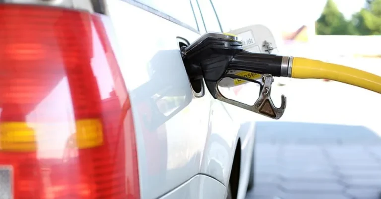 SUV being fueled at a gas station