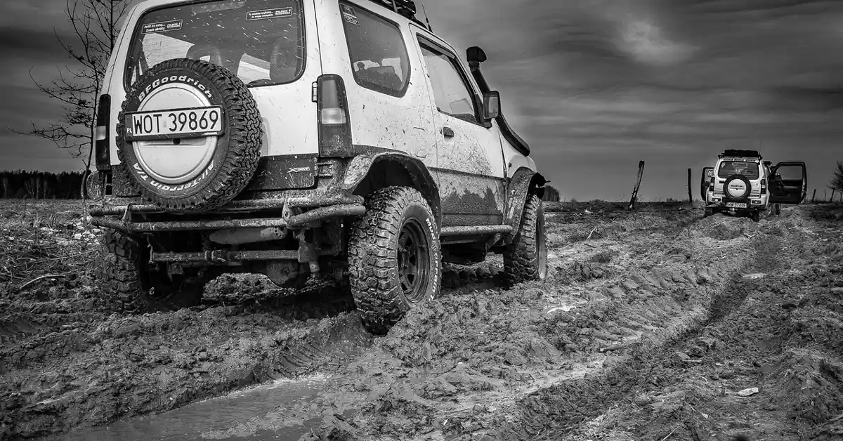 SUV driving off-road with 4-wheel drive engaged