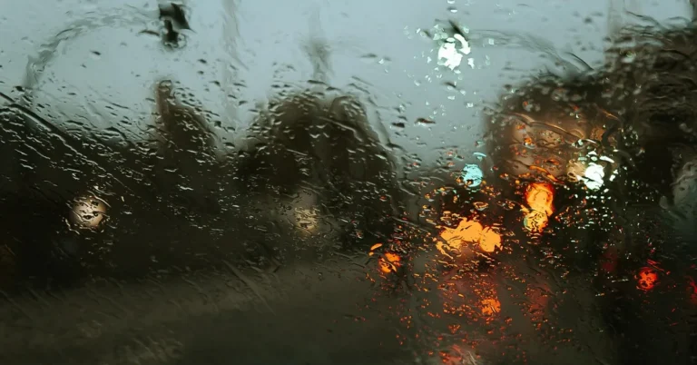 Technician replacing a car windshield