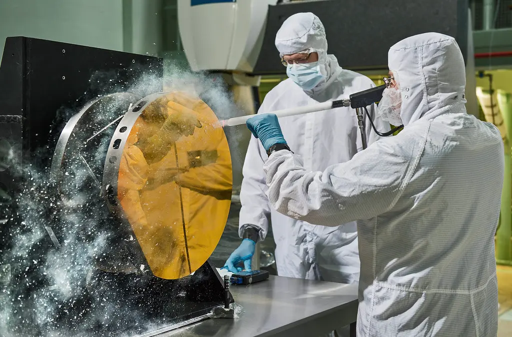 Close-up of engine cleaner being sprayed onto carbon deposits on an intake valve