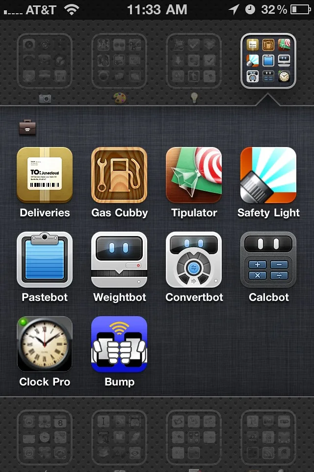 Hands using a car maintenance app beside a tire gauge and fuel receipt