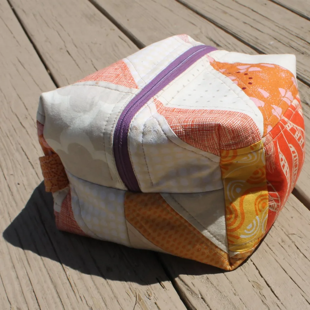 Hands wiping a car seat cover after a small spill with a microfiber cloth