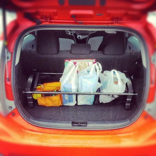 Close-up of a trunk organizer with a cold-food compartment, ice pack, and non-slip base